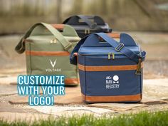 two cooler bags sitting on top of a cement slab with the words customize with your logo