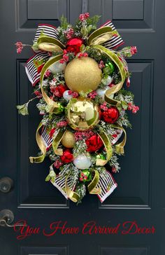 a christmas wreath hanging on the front door