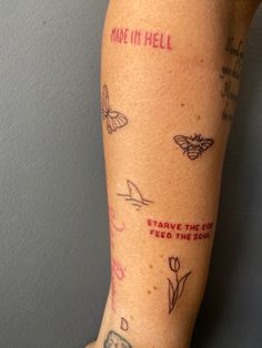 a woman's arm with tattoos and writing on it that says made in hell