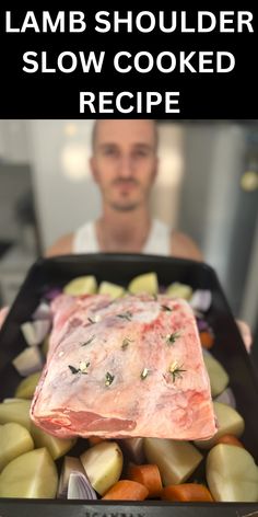 a man holding a tray full of food with the words lamb shoulder slow cooked recipe