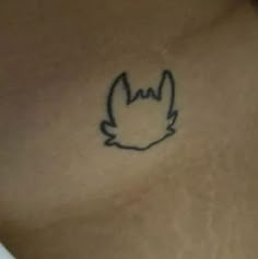 a close up of a person's chest with a tattoo on it