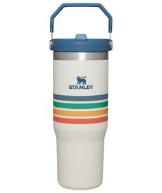 the stanley insulated travel mug is white with blue lid, and features a multi - colored stripe design