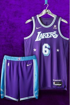 a purple jersey and shorts with the number six on it, hanging from a hanger