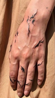 a person's hand with black ink on it