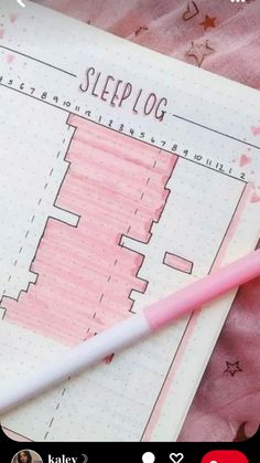 a pink pen sitting on top of a notebook next to a piece of paper that says sleep log