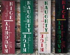 four different types of wooden signs in front of a brick wall