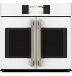 the double oven is white with gold trimmings and two doors on each side