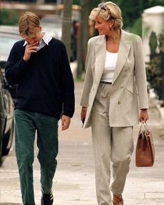 a man and woman walking down the street