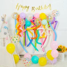 a birthday party with balloons and streamers