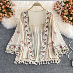 Find ideas๏ฟฝand inspiration for Ladies Embroidered Tasseled Ethnic Blouse Kimono Top Boho Holiday Loose Casual, Womens Coats Jackets Tassel Shirt, Cardigan Summer, White Kimono, Bohemian Kimono, Boho Festival Fashion, Poncho Cardigan, Summer Cardigan, Vintage Inspired Fashion, Embroidered Cardigan