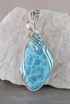 Larimar in sterling silver wire | Wire wrapped stone jewelry, Wire wrapped gemstones pendant, Wire jewelry patterns Silver Wire Jewelry, Wire Wrapped Gemstones Pendant, Bijoux Fil Aluminium