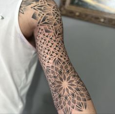 a man with a tattoo on his arm