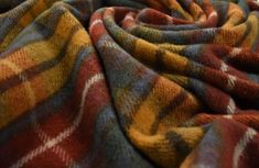 an image of a blanket that looks like it has been made out of plaid fabric