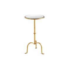 a small table with a glass top and gold metal legs, on a white background