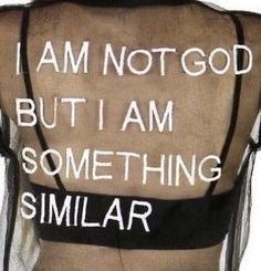 the back of a woman's shirt with writing on it that says, i am not god but i am something similar