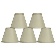 six white lampshades are lined up in a pyramid formation on a white background