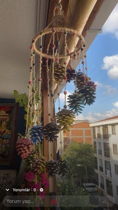 a wind chime hanging from the side of a building