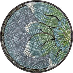 a circular stained glass window with blue and green flowers