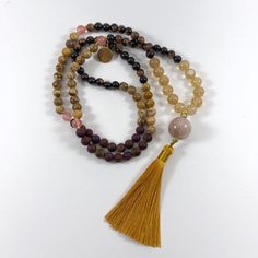 Elevate your meditation and spiritual practice with this handmade Mala necklace, thoughtfully crafted to inspire mindfulness, inner peace, and balance. Each Mala is lovingly hand-strung using 108 natural beads, traditionally used for counting mantras, prayers, or intentions during meditation. The beads are made from gemstones, known for their healing and grounding properties. * Original and one-of-a-kind, you won't find another one like this; * 108 beads: Symbolizing spiritual wholeness and comp Peace And Balance, Beaded Curtains, 108 Bead, Mala Necklace, Natural Beads, Necklace Handmade, Inner Peace, Chain Styles, Handmade Necklaces