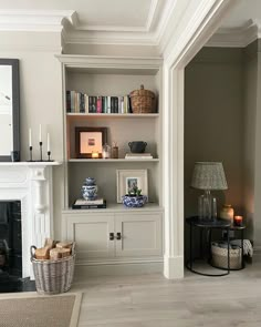 a living room filled with furniture and a fire place