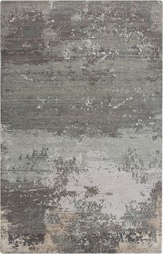 an area rug with various colors and patterns on it, including greys, beiges, and browns