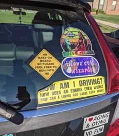 a car with stickers on the back window