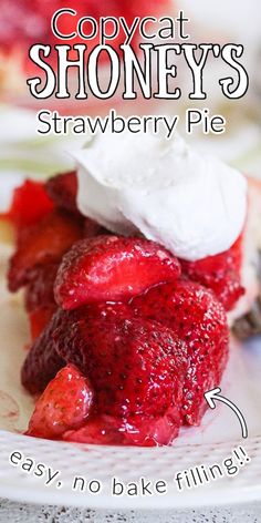 a close up of a plate of food with strawberries and whipped cream on it