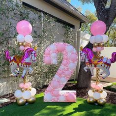 the number twenty two is decorated with balloons