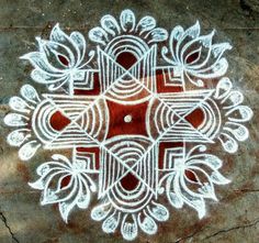 an intricate design on the ground with white paint