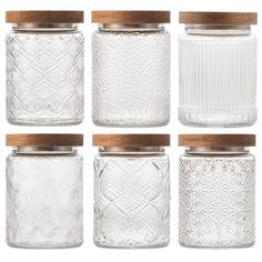 six glass jars with wooden lids