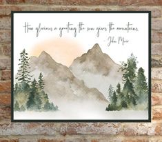 a brick wall with a painting on it that says how glorious a greeting the sun gives the mountains