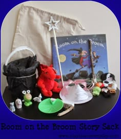 the room on the broom story sack is filled with toys, books and other items