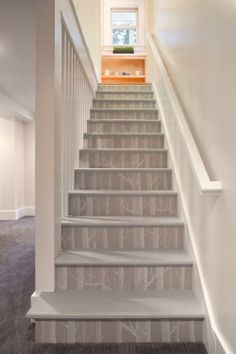 the stairs in this house are painted white