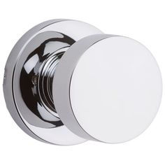 an image of a chrome door knob with white round knobs on the front and sides