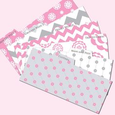 pink and grey patterned envelopes with white flowers on them