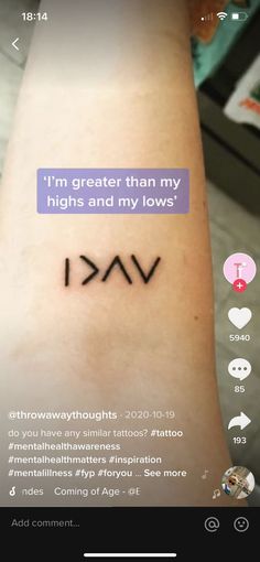 a person with a tattoo on their arm that says i'm greater than my highs and my lows