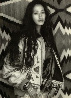 an old photo of a woman with long hair