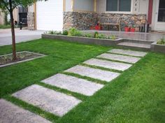 the front yard is clean and ready to be used as an outdoor space for entertaining