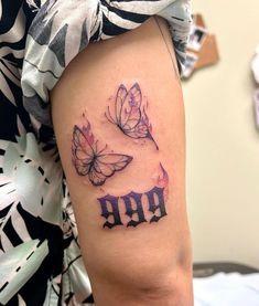 two butterflies with the word boo tattooed on their arm and leg, sitting next to each other