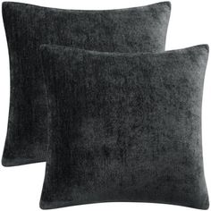 two dark gray velvet pillows on white background with clipping for text or image to be added