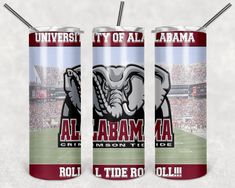 three cans of beer with the words, university of alabama and an elephant on them