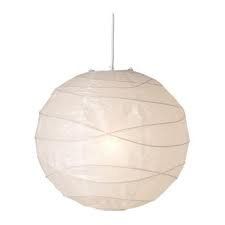 a white paper lantern hanging from a ceiling