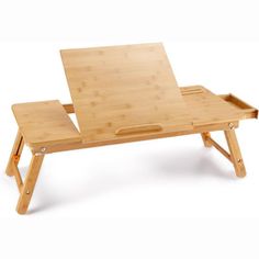 a small wooden table with a laptop on it's top and two legs that are folded down