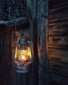 an old fashioned lantern lit up in the dark