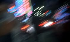 blurry photograph of city street lights at night