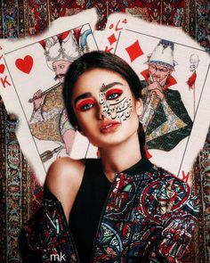 a woman with makeup on her face and playing cards in front of her, the image is