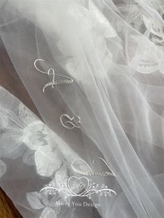 the veil is white and has two different designs on it