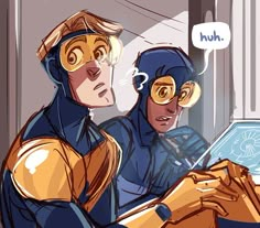 two people in blue and yellow costumes looking at a laptop