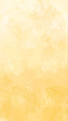 an orange and yellow watercolor background with small white dots on the bottom right corner