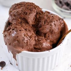 a white bowl filled with chocolate ice cream